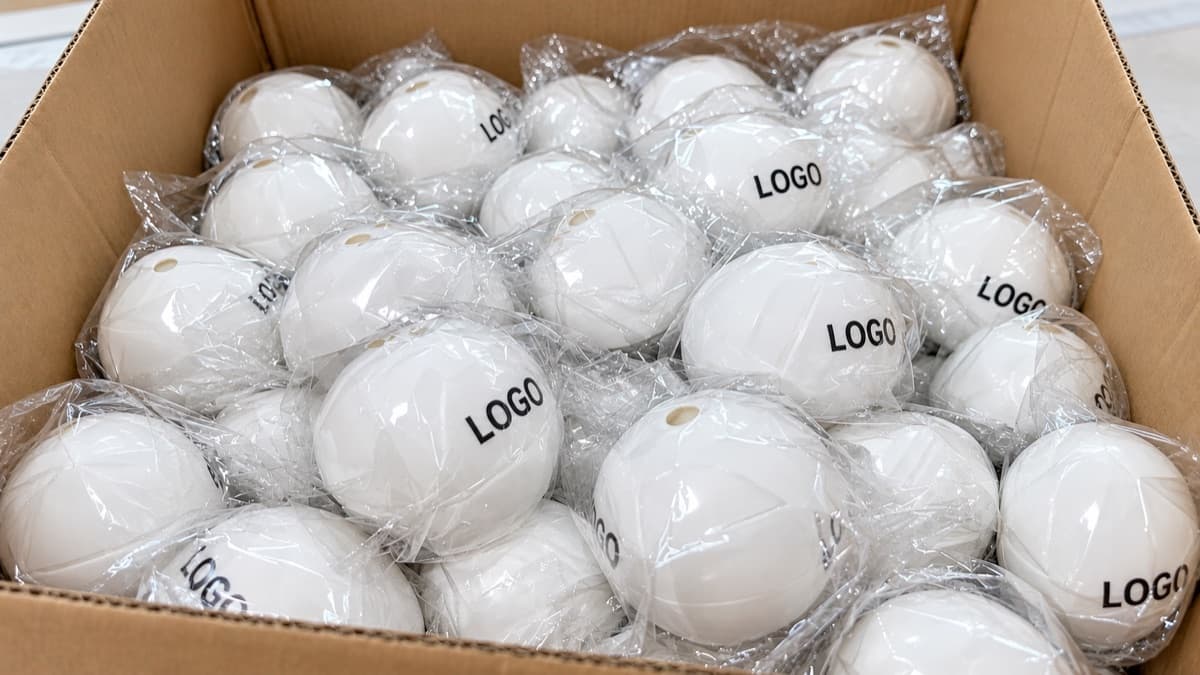 Individually bagged custom-logo ice ball molds prepared in a bulk carton